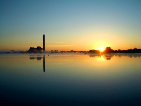 The sun rises behind Muskegon's BC Cobb power plant on the morning of May 23, 2006