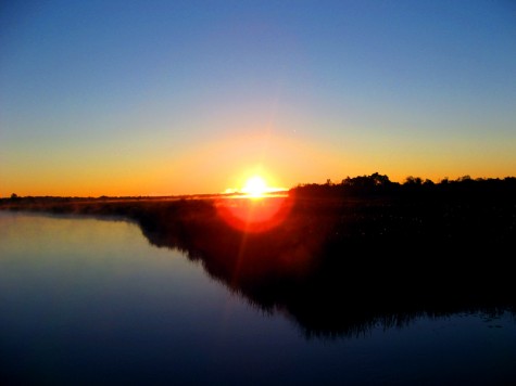 Watching the sunrise from an old railroad bridge over the Muskegon River on October 6, 2006