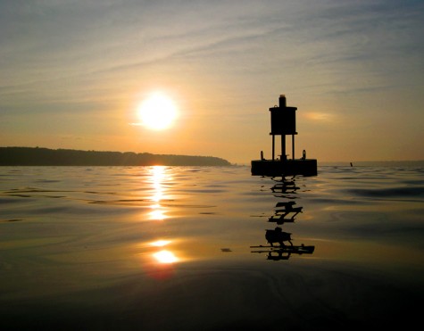 The sun rises across White Lake on the morning of June 27, 2008