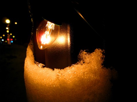 A Christmas light holds its own against the encroaching snow on the morning of December 2, 2008.
