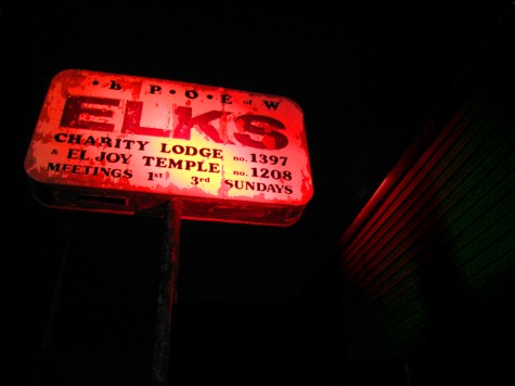 The sign at the old Elks Club on Muskegon's Ottawa Avenue is rarely left on when the club is closed. But, this morning it was blazing away with the red lights lighting up everything around it.