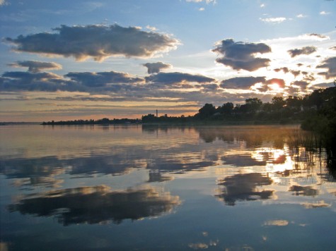 Clouds reflected in Muskegon Lake during the sunrise on July 6, 2009.