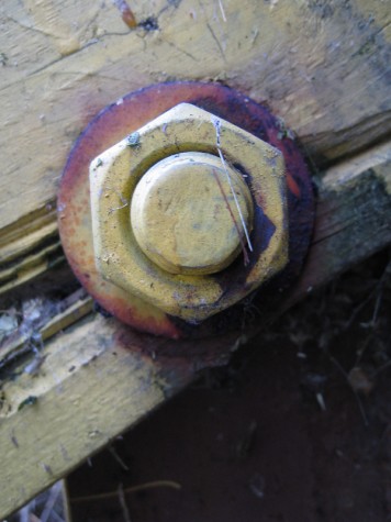 An old, painted nut and bolt at a Muskegon marina.