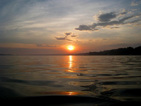 The sun rises over Muskegon County's White Lake on the morning of June 27, 2008